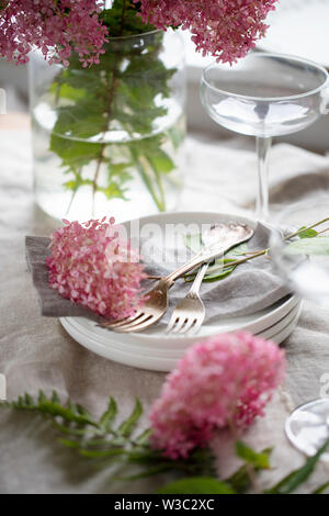 Table setting with hydrangea flowers Stock Photo