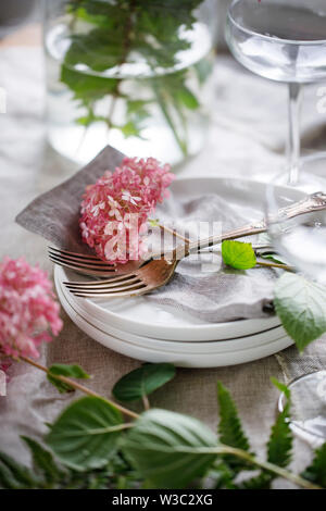 Table setting with hydrangea flowers Stock Photo