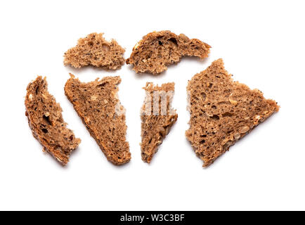 Top view of crumbled multi Grain brown Bread isolated on white Background Stock Photo