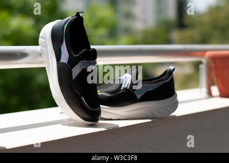 black womens sneakers close up Stock Photo