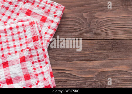 checkered napkins on a wooden background,close-up Stock Photo