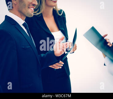 closeup of business partners with working papers before the conference to discuss important points of the speech Stock Photo