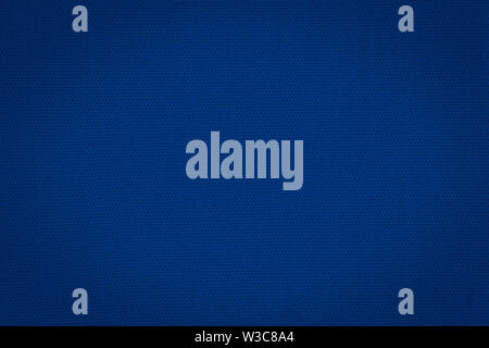 Texture of a real dark blue knit. Fabric background. Stock Photo