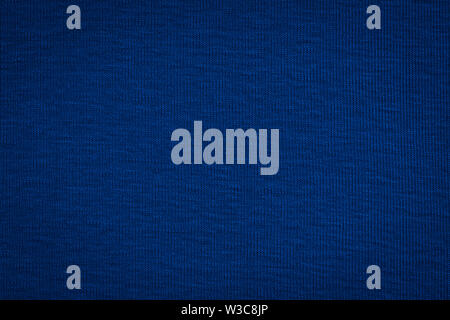Texture of real dark blue knitwear, textile background. Stock Photo