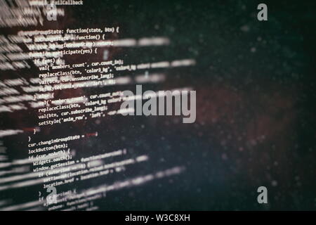 Coding script text on screen. Notebook closeup photo. CSS, JavaScript and HTML usage. Stock Photo