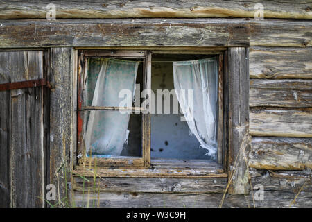 Broken window of an old weathered log sauna building at abandoned farmstead  in Ylöjärvi, Finland Stock Photo - Alamy