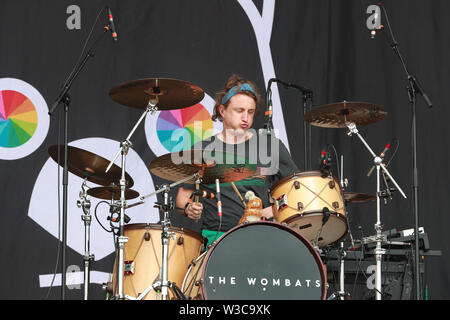 Glasgow, Scotland, UK. 14th July 2019.  Thousands of spectators turned out on the third day of the TRNSMT music festival held in Glasgow Green public park in the centre of Glasgow. The capacity 'sell out' crowd were entertained by many famous bands and singers including THE WOMBATS pictured here. Credit: Findlay/Alamy Live News Stock Photo