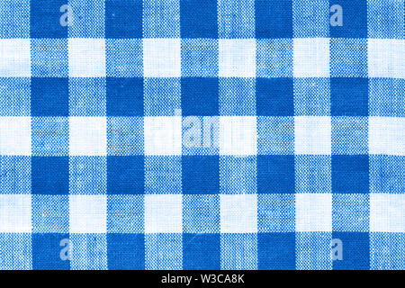 close macro view of white and royal blue  squared pattern fabric texture Stock Photo