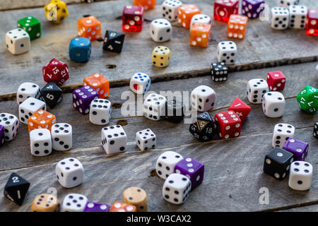 A bunch of dice on a wood background Stock Photo