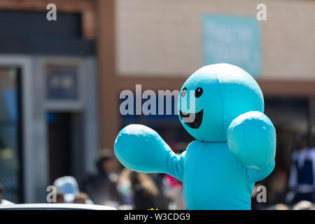 Benton Harbor, Michigan, USA - May 4, 2019: Blossomtime Festival Grand Floral Parade, Car carrying Splash Silver Beach Center Mascot during the parade Stock Photo