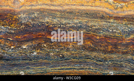 Beautiful rusty colorful background structure for wallpaper. Looks like a semi-precious stone or natural decoration. Stock Photo