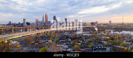 Cars come and go at sunrise before rush hour in Cleveland Ohio on Lake Erie Stock Photo