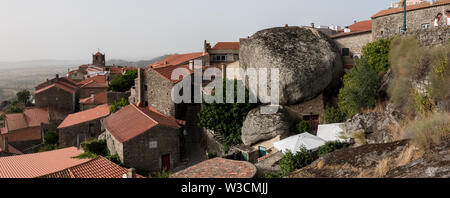 A panoramic view of the stone cut historical houses built in between massive boulders in the village of Monsanto, Portugal. Stock Photo