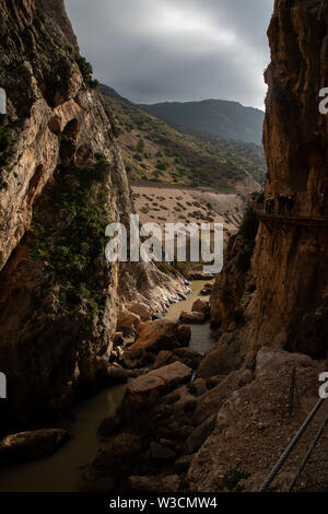 A small part of the El Caminito del Rey in Malaga, Spain is a walkway pinned along the steep walls of a narrow gorge in El Chorro Stock Photo