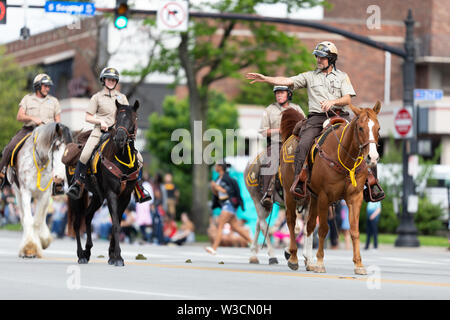 Louisville, Kentucky, USA - May 2, 2019: The Pegasus Parade, Mounted Sheriff riding horses during the parade Stock Photo