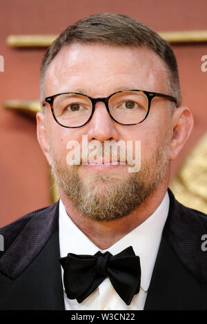 London, UK. 14th July 2019. Guy Ritchie poses on the yellow carpet at the European premiere of Disneys 'The Lion King' on Sunday 14 July 2019 at ODEON LUXE Leicester Square, London. . Picture by Julie Edwards. Credit: Julie Edwards/Alamy Live News Stock Photo