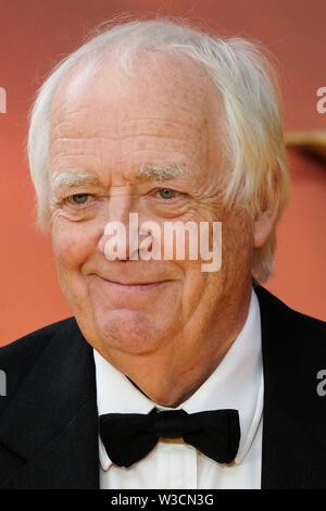 London, UK. 14th July 2019. Sir Tim Rice poses on the yellow carpet at the European premiere of Disneys 'The Lion King' on Sunday 14 July 2019 at ODEON LUXE Leicester Square, London. Tim Rice. Picture by Julie Edwards. Credit: Julie Edwards/Alamy Live News Stock Photo