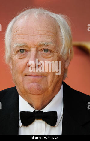 London, UK. 14th July 2019. Sir Tim Rice poses on the yellow carpet at the European premiere of Disneys 'The Lion King' on Sunday 14 July 2019 at ODEON LUXE Leicester Square, London. Tim Rice. Picture by Julie Edwards. Credit: Julie Edwards/Alamy Live News Stock Photo