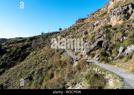 A footpath going through the Sierra Nevadas in Andalucia, Spain near Granada. Stock Photo