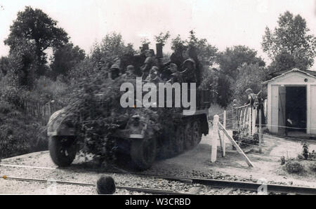 German Soldiers in a Heavily Camouflaged Haltrack with mounted Four Barrel Anti Aircraft Gun in Normandy france 1944 Stock Photo