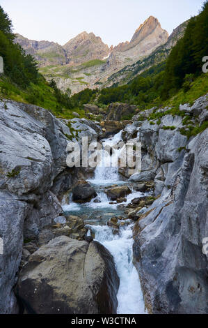 Cinca river at dusk with Pineta and Garien peaks in the background in Ordesa y Monte Perdido National Park (Sobrarbe, Huesca, Pyrenees, Aragon, Spain) Stock Photo