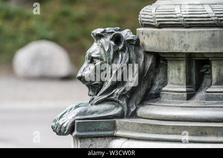 Fragment of a bronze lion sculptures at the base of the monument Stock Photo