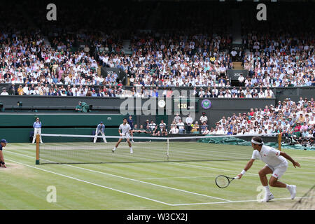 Wimbledon, London, UK. 14th July 2019. Novak Djokovic of Serbia and Roger Federer of Switzerland during the men's singles final match of the Wimbledon Lawn Tennis Championships at the All England Lawn Tennis and Croquet Club in London, England on July 14, 2019. Credit: AFLO/Alamy Live News Stock Photo