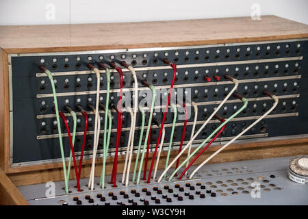 A telephone switch board is a telecommunications system used in the public switched telephone network to establish telephone calls between subscribers. Stock Photo