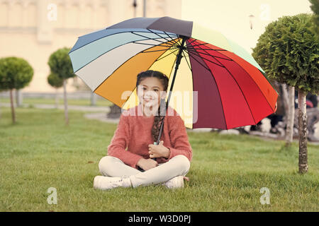 Colorful accessory for cheerful mood. Girl child long hair with umbrella. Colorful accessory positive influence. Bright umbrella. Stay positive and optimistic. Everything better with my umbrella. Stock Photo