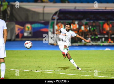 Cairo. 14th July, 2019. Riyad Mahrez of Algeria scores during the semifinal match between Algeria and Nigeria at the 2019 Africa Cup of Nations in Cairo, Egypt on July 14, 2019. Credit: Li Yan/Xinhua/Alamy Live News Stock Photo