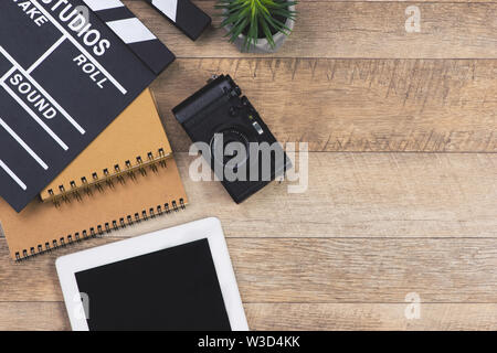 Film director desk with movie clapper board. Top view. Stock Photo