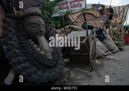 Clay Statues getting ready in the streets of  Kumartuli,Kolkata,India Stock Photo