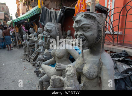 Clay Statues getting ready in the streets of  Kumartuli,Kolkata,India Stock Photo