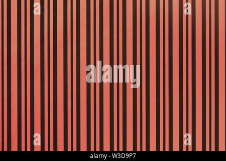 Dark red and black background from wrapping paper with a pattern of line closeup. Texture of holiday striped paper surface. Backdrop of ginger textile Stock Photo