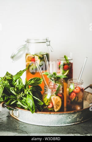 Fresh strawberry and basil lemonade or iced-tea in glasses Stock Photo