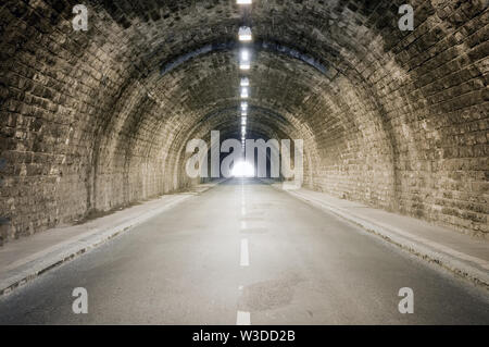 light at the dark tunnel vanishing point end Stock Photo