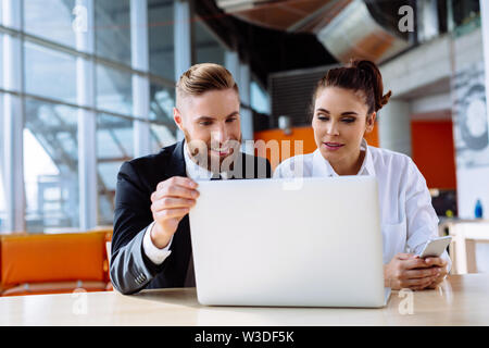 Two business partners discussing new project Stock Photo