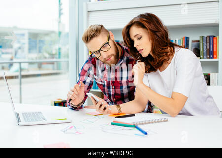 small business partners working together in office designing new website Stock Photo