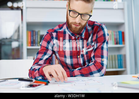 Web designer working on new responsive design at office Stock Photo