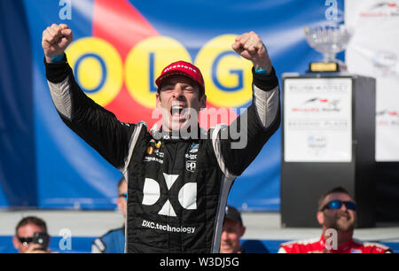 (190715) -- TORONTO, July 15, 2019 (Xinhua) -- Team Penske's driver Simon Pagenaud of France celebrates victory during the awarding ceremony of the 2019 Honda Indy Toronto of the NTT IndyCar Series at Exhibition Place in Toronto, Canada, July 14, 2019. Team Penske's driver Simon Pagenaud of France claimed the title with a time of 1:30:16.4388. (Xinhua/Zou Zheng) Stock Photo