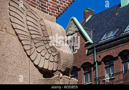 Lund, Sweden - June 23, 2019: stone eagle sitting in a street corner on building Stock Photo