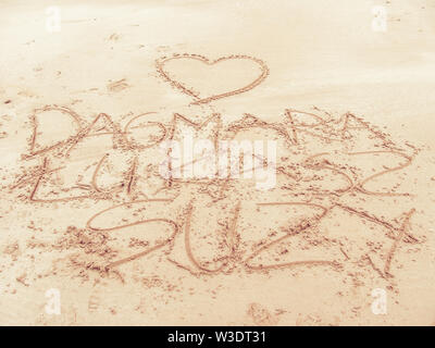 Writing on a beach - love letters on sand Stock Photo