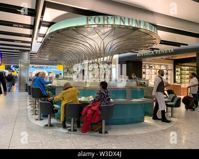 London, UK - 20th May 2019: Fortnum and Mason cafe bar in Heathrow Airport. This famous London retailer is renowned for fine food, teas, coffees and w Stock Photo