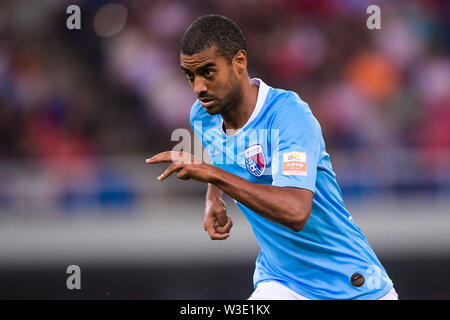 Brazilian football player Alan Douglas Borges de Carvalho, simply known as Alan, of Tianjin Tianhai dribbles against Shenzhen F.C. in their 17th round match during the 2019 Chinese Football Association Super League (CSL) in Tianjin, China, 13 July 2019. Tianjin Tianhai played draw to Shenzhen F.C. 2-2. Stock Photo