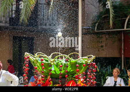 Barcelona, Spain. Interior garden of Ateneu Barcelones. Ou com balla in fountain, Corpus day tradition. Stock Photo