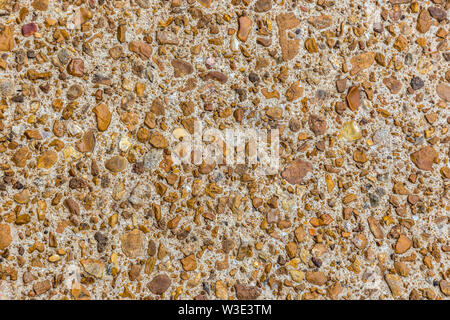Colorful stones set in concrete on a path for a texture background. Stock Photo