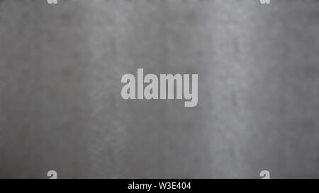 Texture backgroud in gray, with lighter vertical stripes, and faint spolodges of darker gray. Stock Photo
