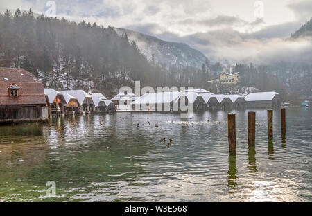 riparian scenery including lots of boathouses around Schoenau am Koenigssee in Bavaria at winter time Stock Photo