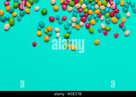 colored candies on blue background Stock Photo