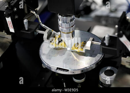 Manual probe system for RF test of semiconductor silicon wafers. Selective focus. Stock Photo